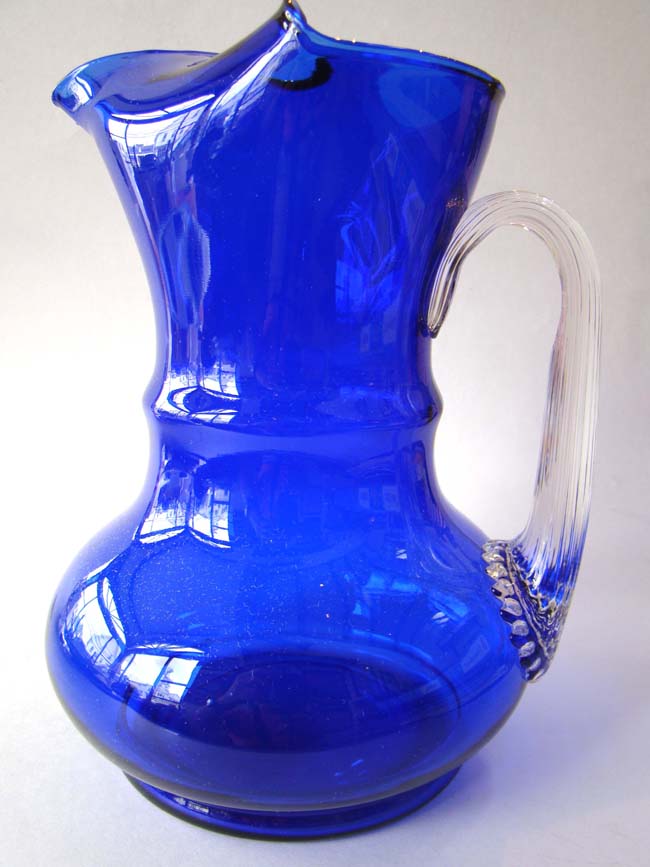 A fabulous vintage colbalt blue glass pitcher